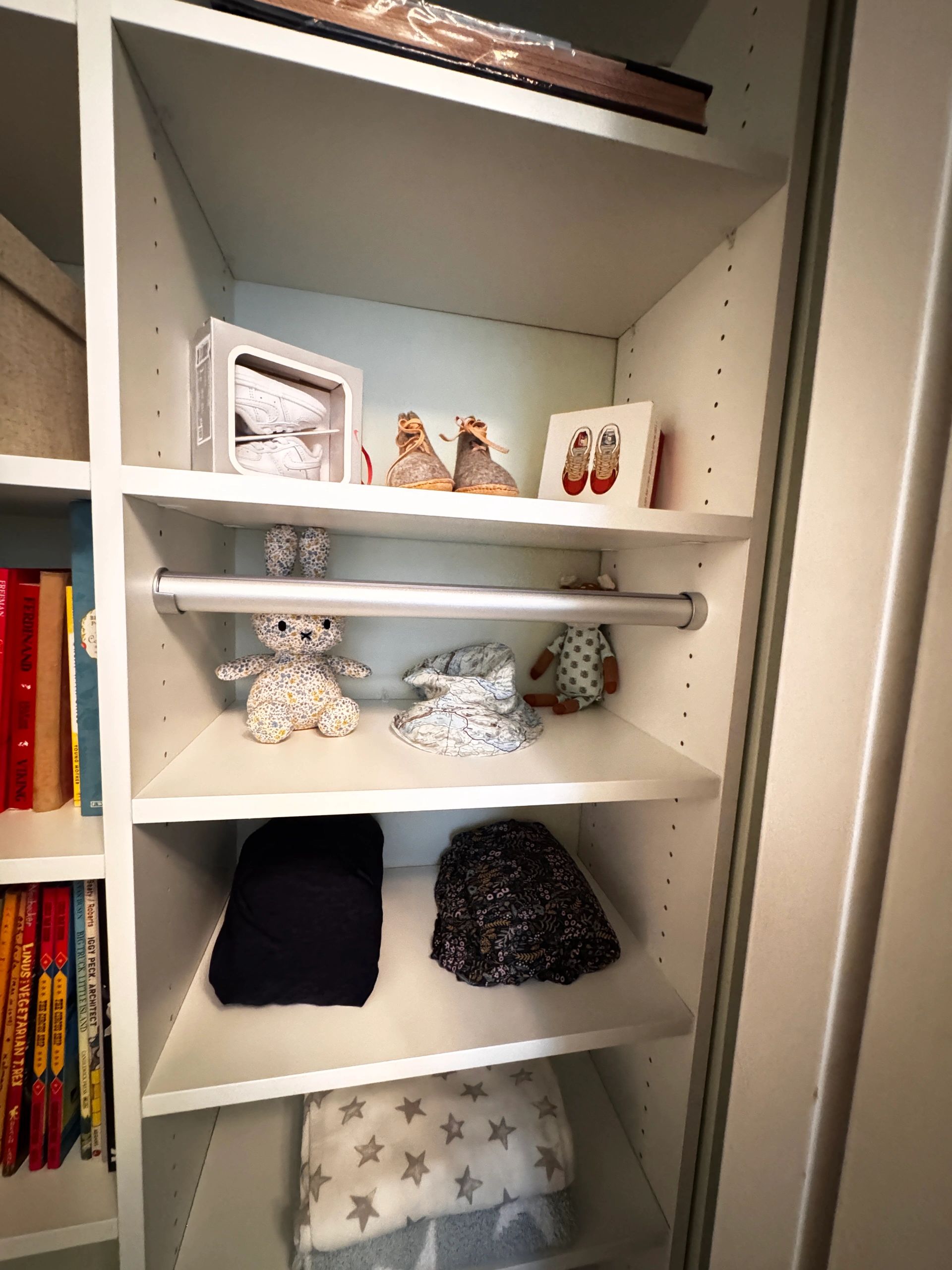 Children's closet with shoes, toys, and clothing