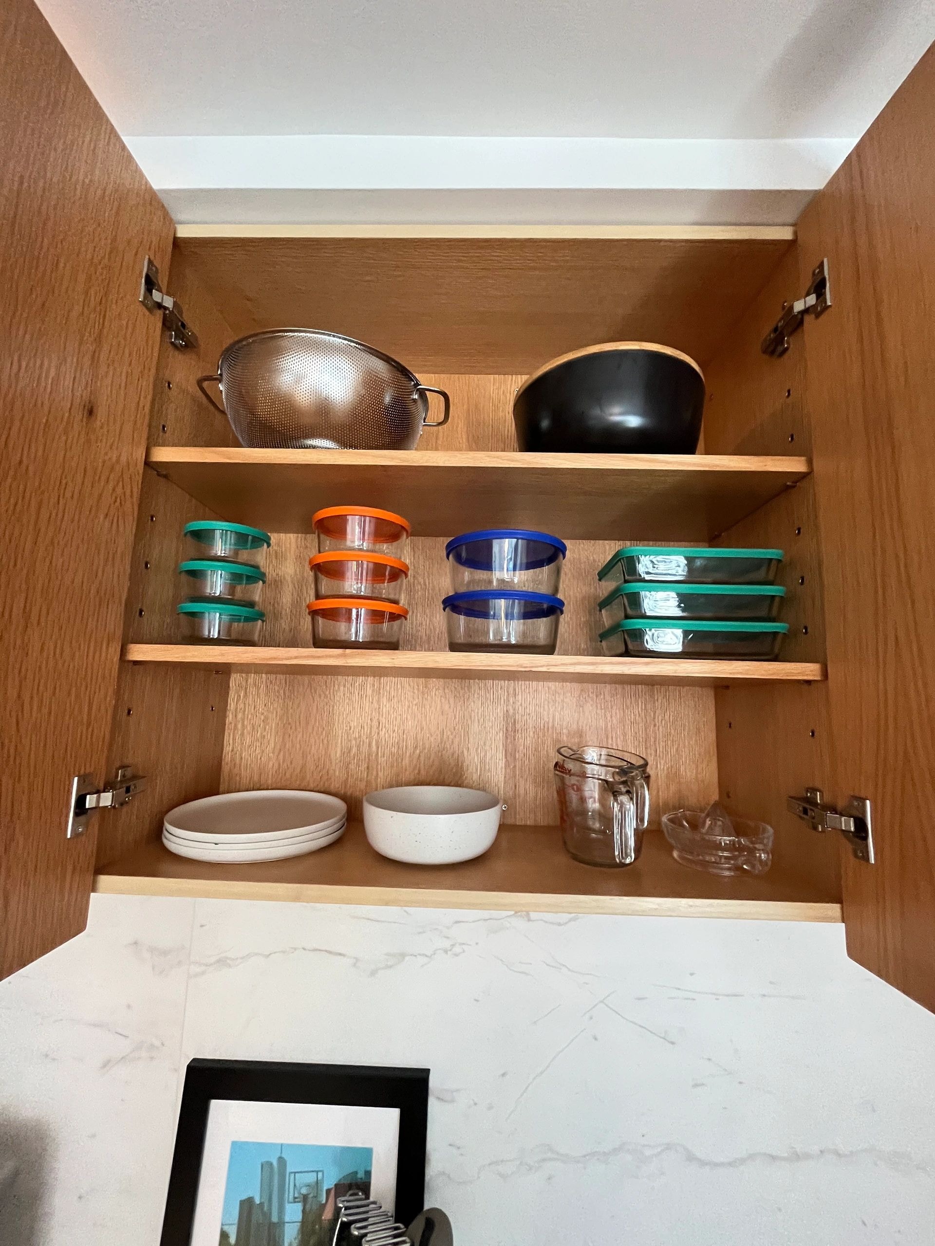 Kitchen cabinet with cookware and food storage