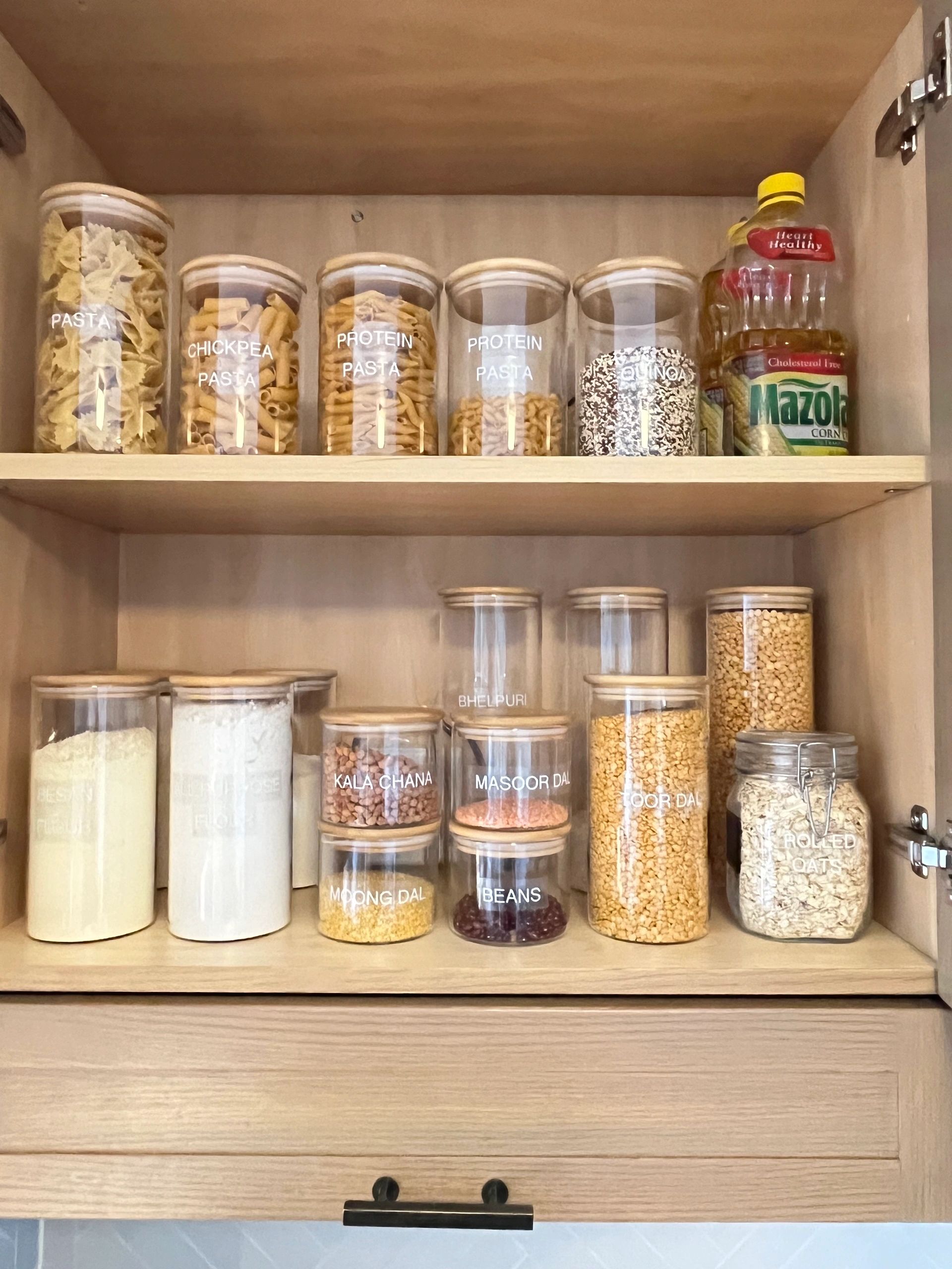 Organized pantry with clear labeled containers